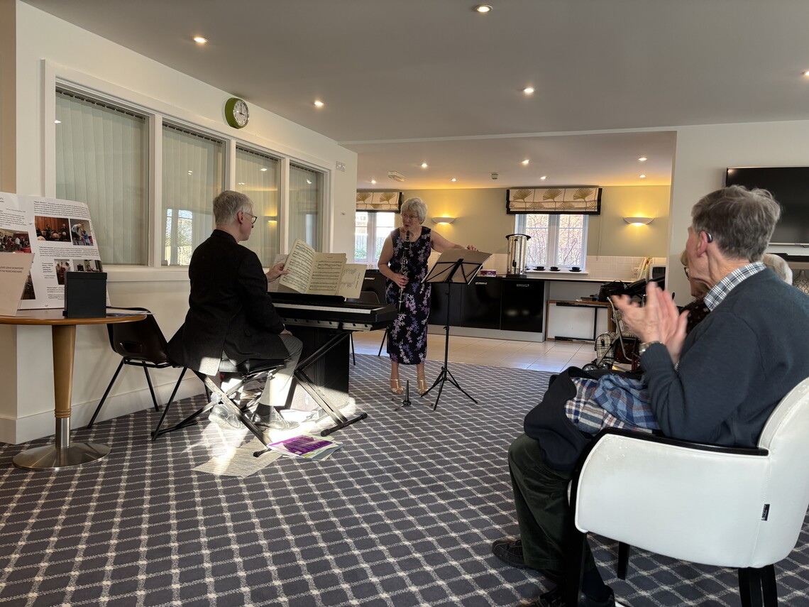 John piano and Margaret clarinet with audience at Yew Tree Court